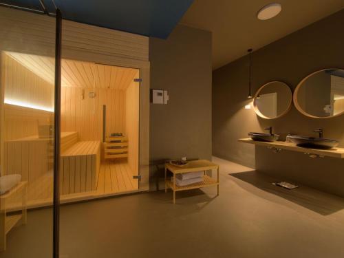 a bathroom with a sink and a tub and a mirror at Villa Miryam by Interhome in Vrh