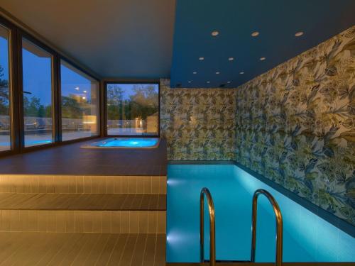 a pool in the middle of a room with a view at Villa Miryam by Interhome in Vrh