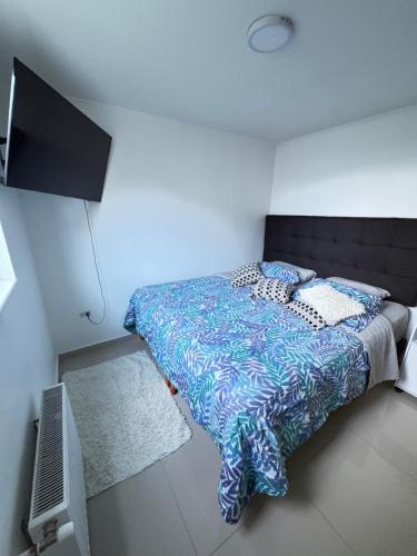 Ένα ή περισσότερα κρεβάτια σε δωμάτιο στο Condominio Anggie