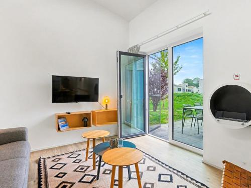 Μια τηλεόραση ή/και κέντρο ψυχαγωγίας στο Holiday Home Küstenzauber by Interhome