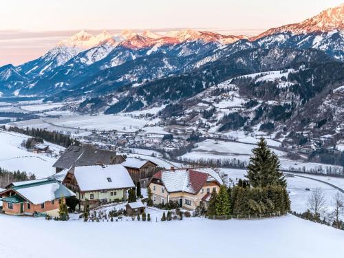 a town in the snow with mountains in the background at Holiday Home Bio-Landhaus Kesslerhof-6 by Interhome in Moosheim