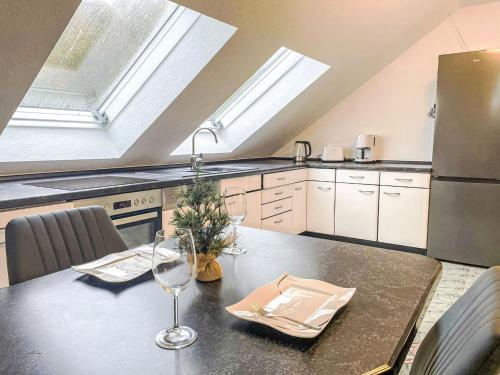a kitchen with a table with a christmas tree on it at Holiday Home Naturnah mit Pool und Sauna by Interhome in Waldau