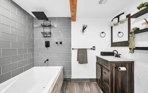 a bathroom with a tub and a sink at The Perfect South Florida Experience in Fort Lauderdale