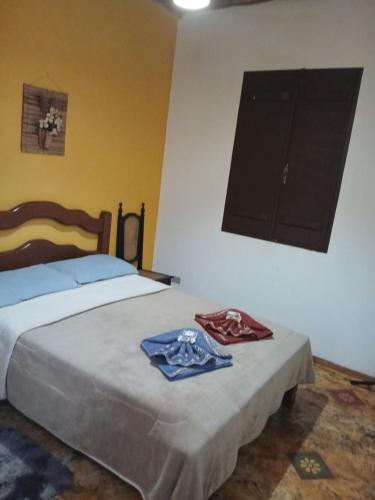 Postel nebo postele na pokoji v ubytování Mini Casarão