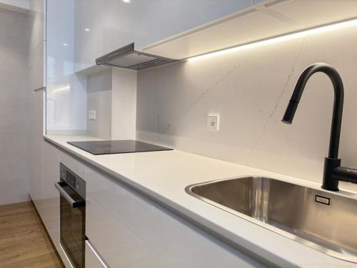 a kitchen with a sink and a counter top at YBH Atlantic Boutique in Vigo