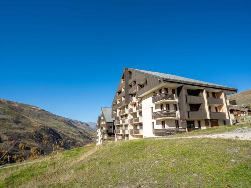 a building on the side of a hill at Apartment Sarvan 208 by Interhome in Les Menuires