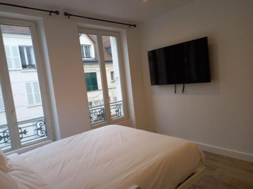 Una televisión o centro de entretenimiento en 243- Jardin de Jouy - Vincennes Centre