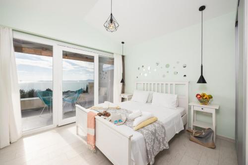 Ένα ή περισσότερα κρεβάτια σε δωμάτιο στο Villa Damian