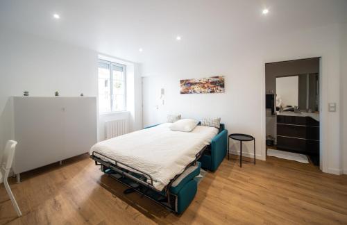 Ένα ή περισσότερα κρεβάτια σε δωμάτιο στο Le Manon 2