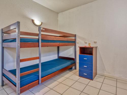 En eller flere senge i et værelse på Holiday Home Marina de Talaris by Interhome