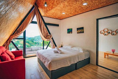 Postel nebo postele na pokoji v ubytování ภูแสงไฟ โฮมสเตย์