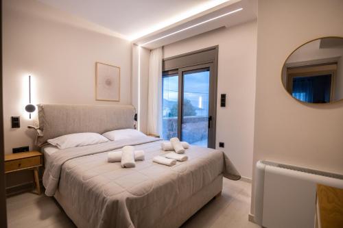 Giường trong phòng chung tại Villa Ammos