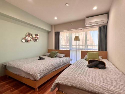 Ένα ή περισσότερα κρεβάτια σε δωμάτιο στο Aa歌舞伎町 东京最中心 东新宿四分钟