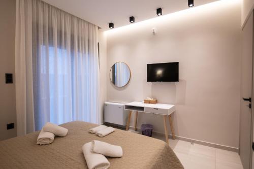 Giường trong phòng chung tại Villa Ammos