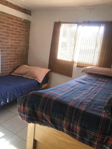 Postel nebo postele na pokoji v ubytování Casita El Mirador Trasla