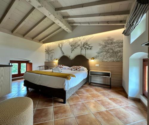 a bedroom with a bed and a painting on the wall at Castello Belvedere Apartments in Desenzano del Garda