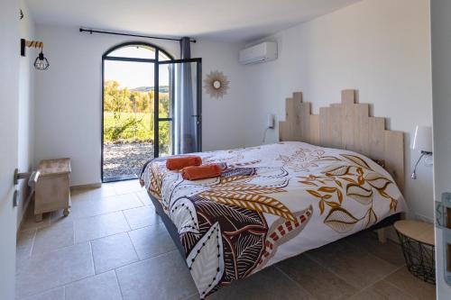 Ένα ή περισσότερα κρεβάτια σε δωμάτιο στο Gîte La Mosaïque