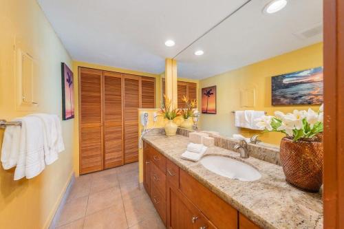 a bathroom with a sink and a counter top at Napili Point A9 · NP A9 OceanFront 1BD Tropical Getaway w Ocean in Kahana