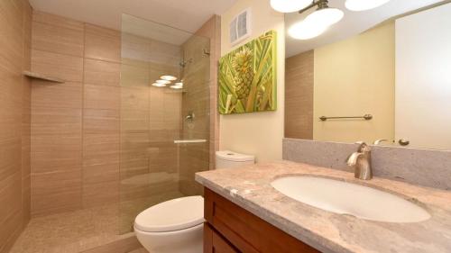 a bathroom with a sink and a toilet at Kaleialoha 401 · KA 401 Spacious Studio w Mountain View Pool AC in Kahana
