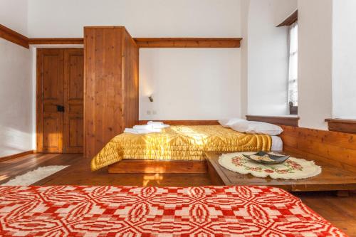 a hotel room with two beds and a table at Archontiko Filippidi in Miléai