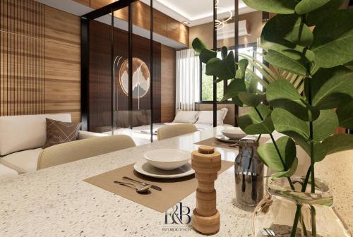 a dining room with a table and a vase with a plant at Premium Unit in Maldives in Manila