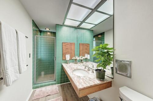 a bathroom with a sink and a shower at Waterfront Home by Ralph Twitchell in Sarasota