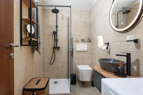 a bathroom with a shower and a sink and a toilet at Haus Vita in Pula