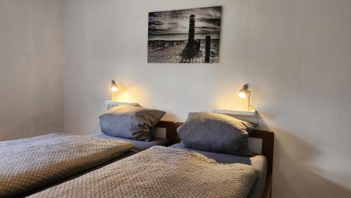 Postel nebo postele na pokoji v ubytování Ferienwohnung FeWo Plaggenburg- die Kleine große