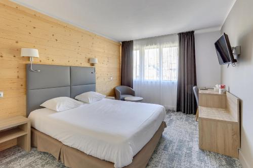 Postel nebo postele na pokoji v ubytování Hôtel Vauban Briançon Serre Chevalier