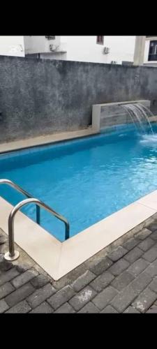 a large blue swimming pool with at Primefix in Lekki