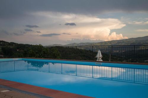 a swimming pool with a view of a mountain at Casa Tiglio in Pratovecchio
