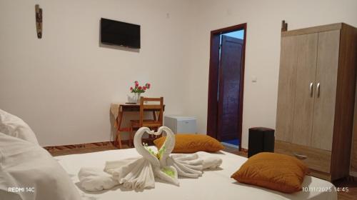 Ένα ή περισσότερα κρεβάτια σε δωμάτιο στο Pensão restauração horizonte