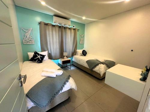 Postel nebo postele na pokoji v ubytování 23 Isikhulu