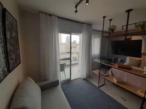 Ένα ή περισσότερα κρεβάτια σε δωμάτιο στο Estúdio Conceito A Completo no Centro de São Paulo