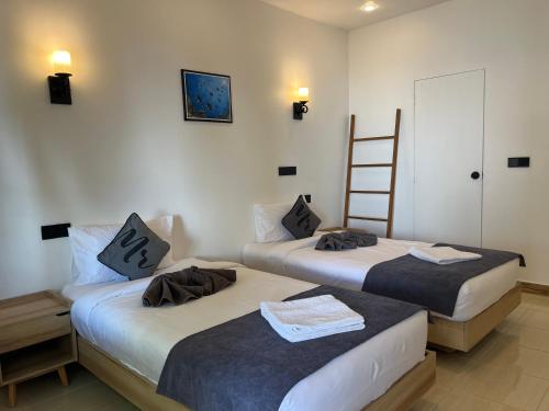 Postel nebo postele na pokoji v ubytování Ahiva Village