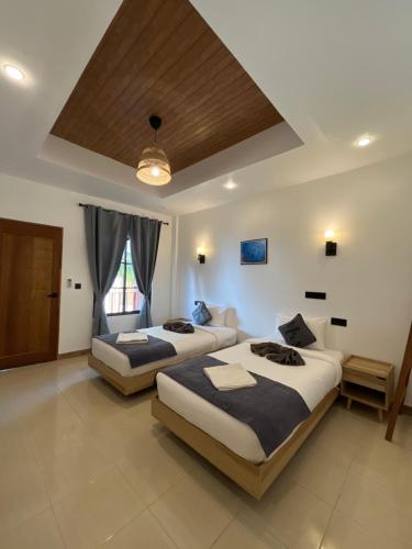 Postel nebo postele na pokoji v ubytování Ahiva Village