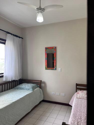 En eller flere senge i et værelse på Condomínio Vila das Gaivotas - Casa 10