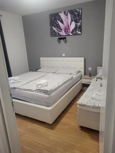 a bedroom with a bed in a room at Apartman D&D 1 in Jajce