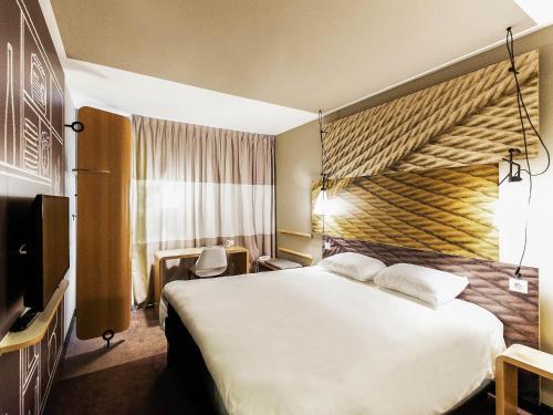 Postel nebo postele na pokoji v ubytování Ibis Poznan Polnoc