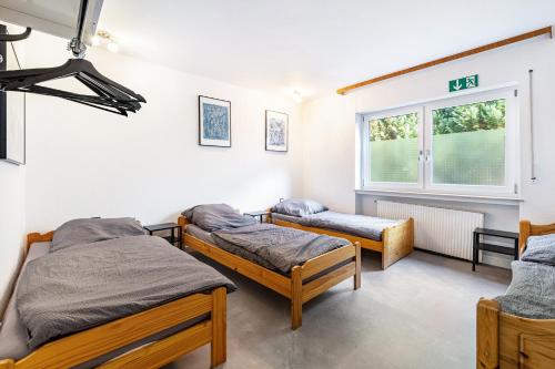 Postel nebo postele na pokoji v ubytování Gästehaus