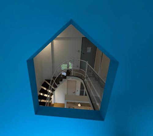 a view of a spiral staircase in a blue box at 星野度假村Village Alpha Tomamu复式公寓套房 in Tomamu