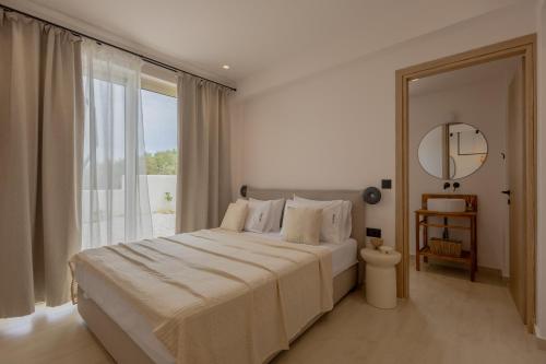 Postel nebo postele na pokoji v ubytování Casa Astra Agia Marina