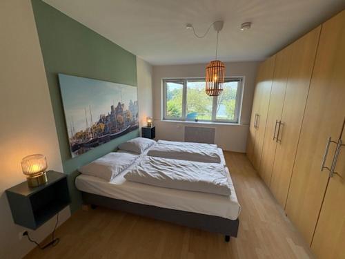 Postel nebo postele na pokoji v ubytování Aparthotel Am Mühlenteich