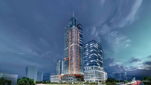 a rendering of a tall skyscraper in a city at BOULEVARD NEST RESlDENCE in Tashkent