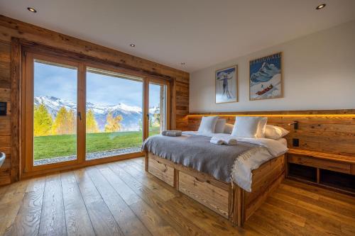 Postel nebo postele na pokoji v ubytování Chalet Cimes and Dreams - Petit coin de paradis