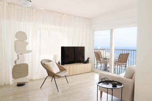 Μια τηλεόραση ή/και κέντρο ψυχαγωγίας στο Apartment with sea view in Cullera