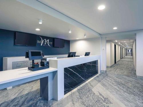 an office with a desk with a computer on it at Mercure Tamworth in Tamworth
