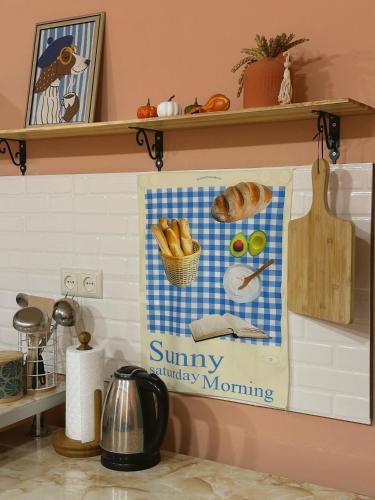 a kitchen counter with a sign that reads sunny unhappy morning at Lilia's Cozy Duplex In The City Center in Yerevan