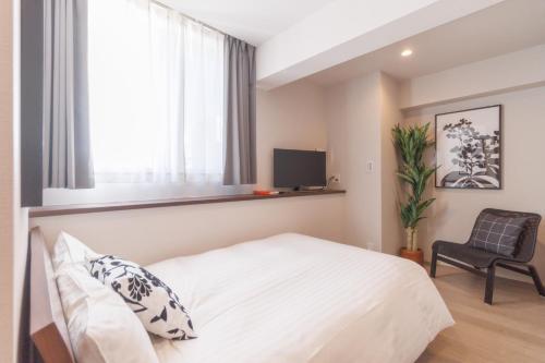 Postel nebo postele na pokoji v ubytování LANG HOTEL Kameido - Vacation STAY 79071v