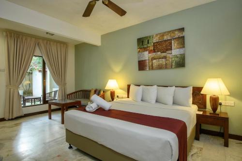 Postel nebo postele na pokoji v ubytování Frangipani Langkawi Resort
